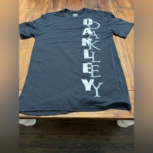 A black Oakley T-shirt.